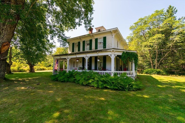 292300 Main Rd, Islesboro, ME 04848 - view of front facade featuring a chimney, a front lawn, and a porch