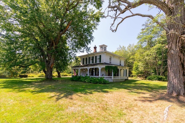292300 Main Rd, Islesboro, ME 04848 - view of front of property with a front yard, a porch, and a chimney
