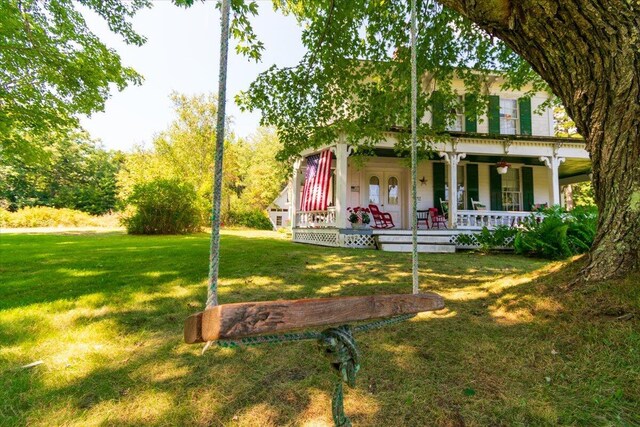 exterior space featuring a front yard and covered porch