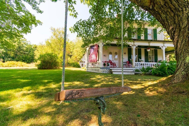 292300 Main Rd, Islesboro, ME 04848 - view of front facade featuring covered porch and a front lawn