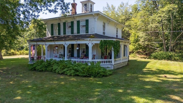 292300 Main Rd, Islesboro, ME 04848 - view of front facade featuring covered porch, a chimney, and a front yard