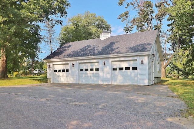 garage with a yard