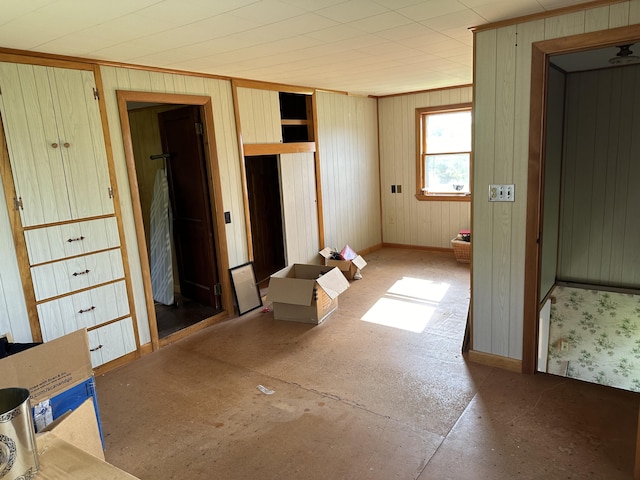 interior space featuring ornamental molding and baseboards