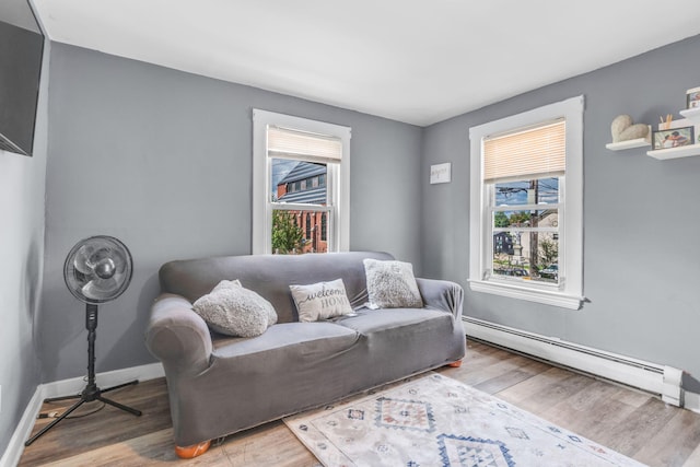 living room featuring hardwood / wood-style floors and baseboard heating