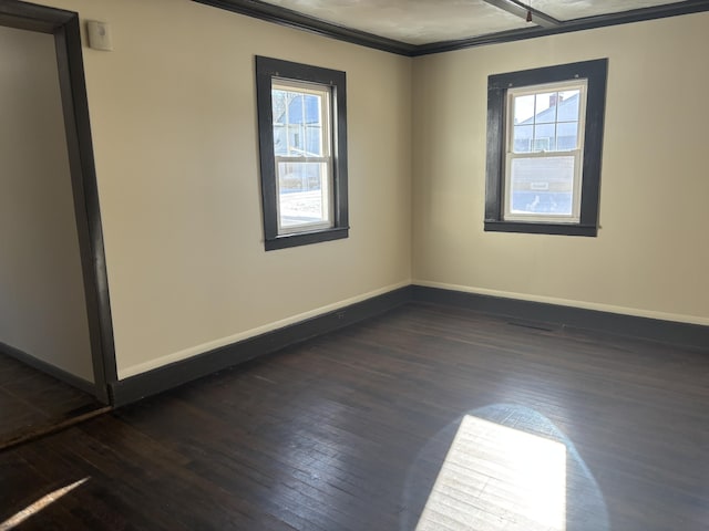 unfurnished room with dark hardwood / wood-style flooring and ornamental molding