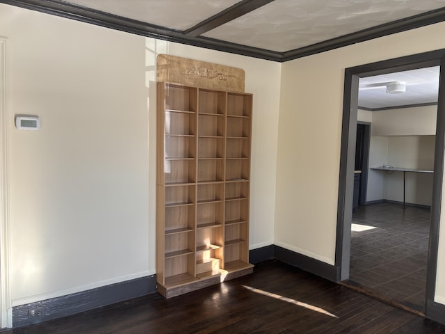 interior space featuring crown molding and dark hardwood / wood-style flooring