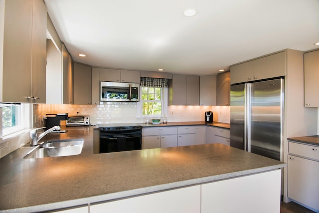 41 Sandpiper Ln, Bristol, ME 04539 - kitchen with gray cabinetry, appliances with stainless steel finishes, a sink, and tasteful backsplash