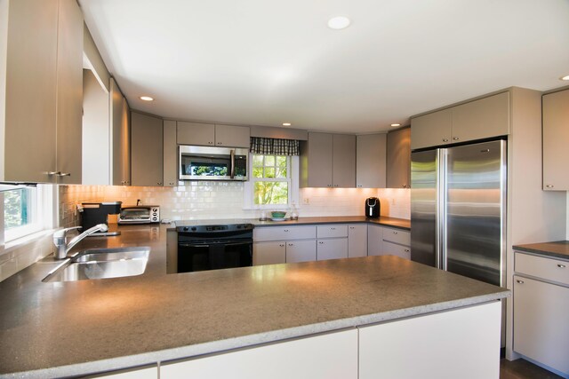 41 Sandpiper Ln, Bristol, ME 04539 - kitchen featuring backsplash, appliances with stainless steel finishes, a sink, and gray cabinets