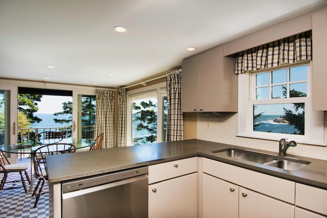 41 Sandpiper Ln, Bristol, ME 04539 - kitchen featuring a sink, a healthy amount of sunlight, a peninsula, and dishwasher