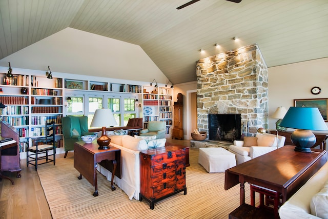 41 Sandpiper Ln, Bristol, ME 04539 - living area featuring ceiling fan, a stone fireplace, wood finished floors, and lofted ceiling