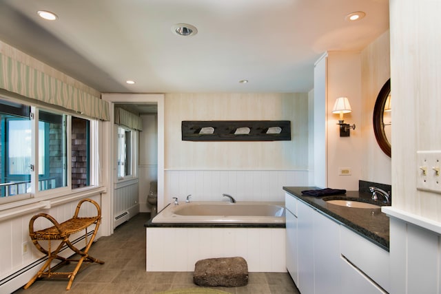 41 Sandpiper Ln, Bristol, ME 04539 - bathroom featuring baseboard heating, vanity, recessed lighting, a baseboard radiator, and a bath