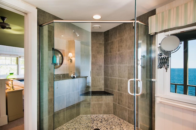 41 Sandpiper Ln, Bristol, ME 04539 - full bathroom featuring a stall shower and a water view