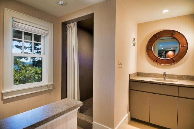 41 Sandpiper Ln, Bristol, ME 04539 - full bathroom featuring vanity, baseboards, and tiled shower
