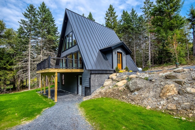 view of front of property with a front lawn and a deck