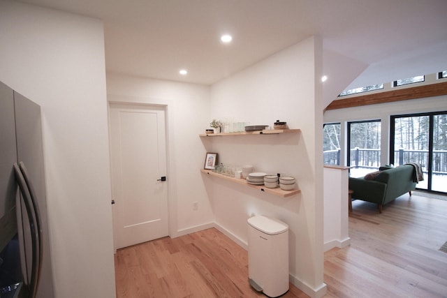 hall with light hardwood / wood-style flooring