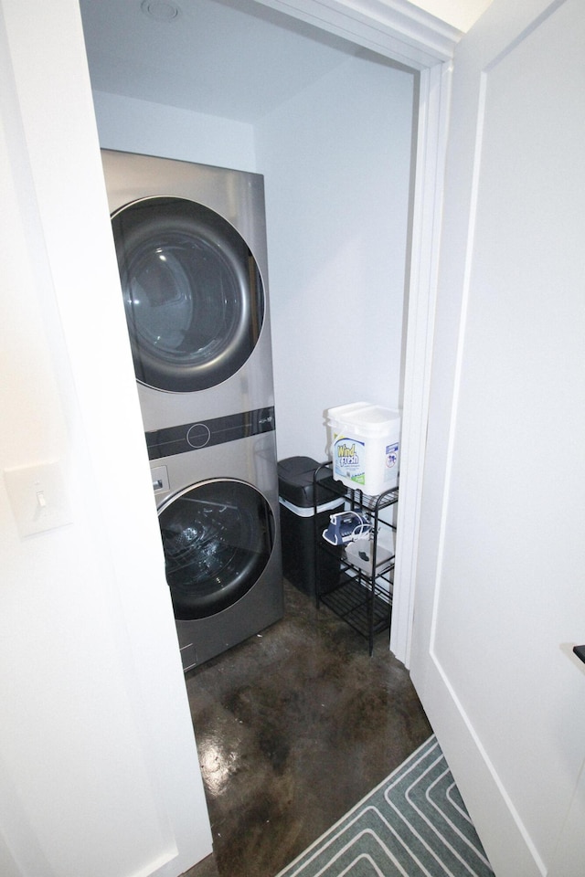 washroom with stacked washer / drying machine