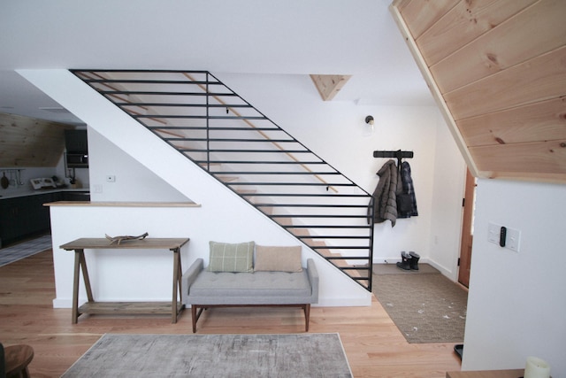 stairs with hardwood / wood-style floors