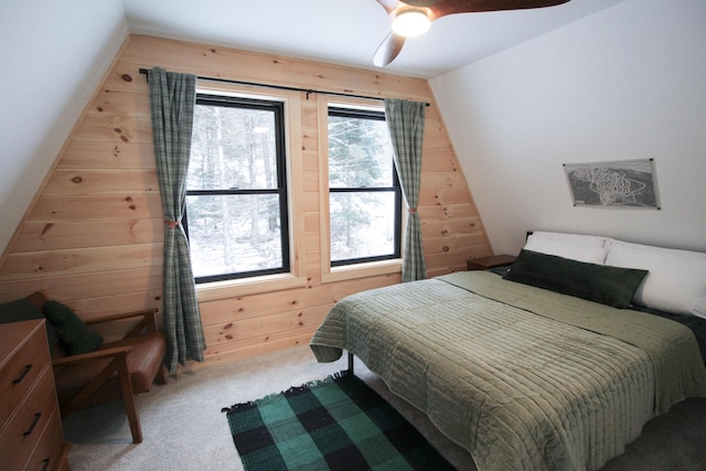 bedroom with ceiling fan, light carpet, and vaulted ceiling