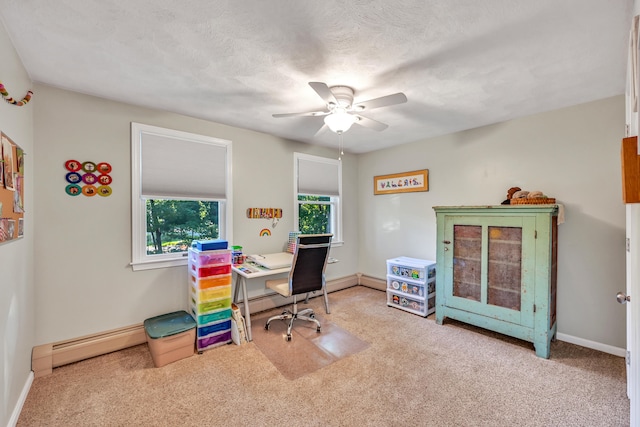 carpeted home office featuring a textured ceiling, a baseboard radiator, and ceiling fan