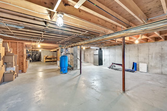 basement featuring stainless steel fridge