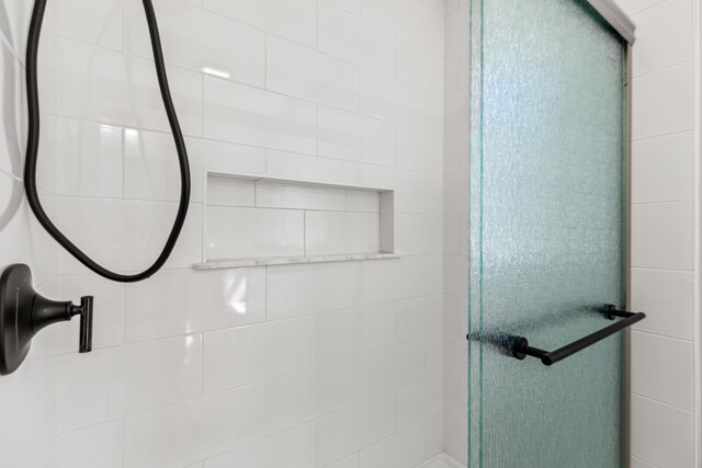 bathroom featuring an enclosed shower