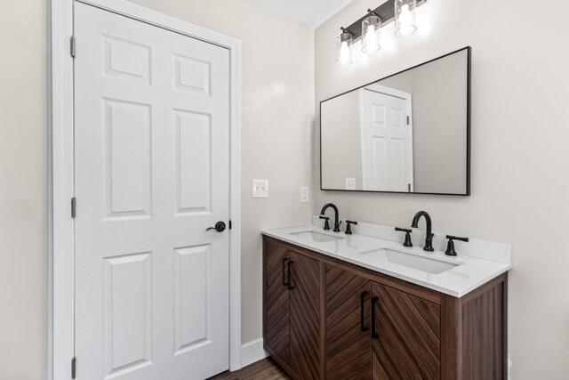 bathroom with vanity and hardwood / wood-style flooring