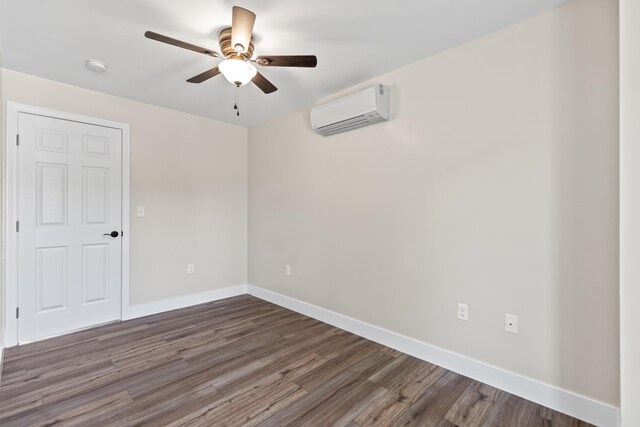 unfurnished room with dark wood-type flooring, ceiling fan, and a wall unit AC