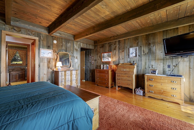 bedroom featuring wood walls, beamed ceiling, wooden ceiling, and wood finished floors