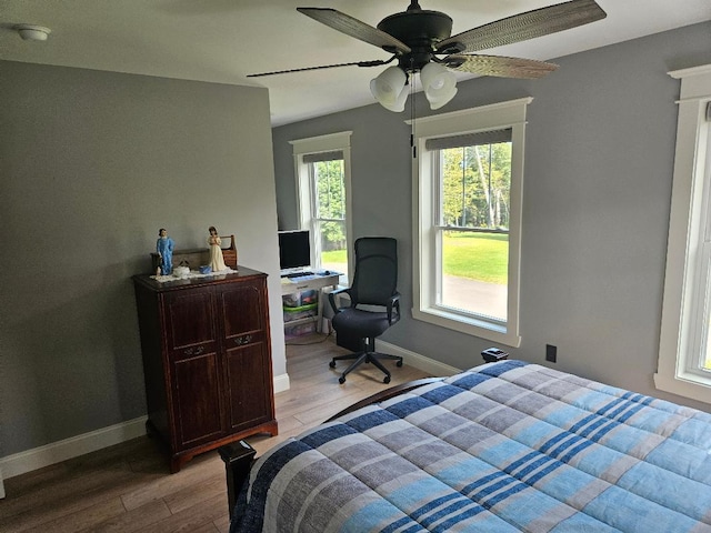 bedroom featuring ceiling fan and hardwood / wood-style flooring