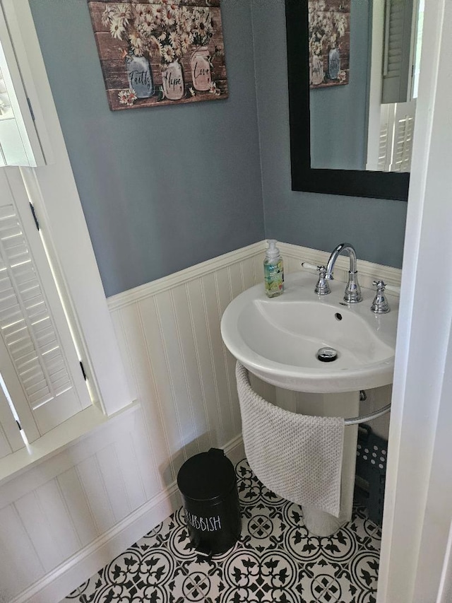 bathroom with tile patterned floors