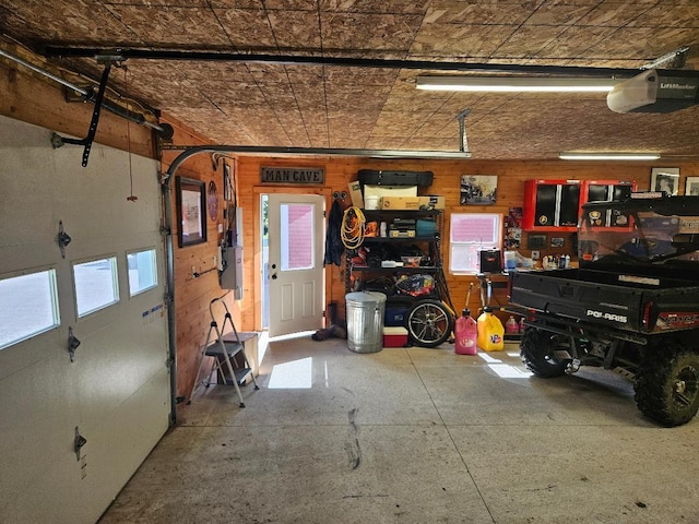 garage featuring a workshop area and a garage door opener