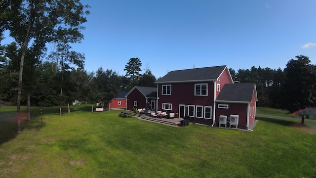 rear view of property with a yard