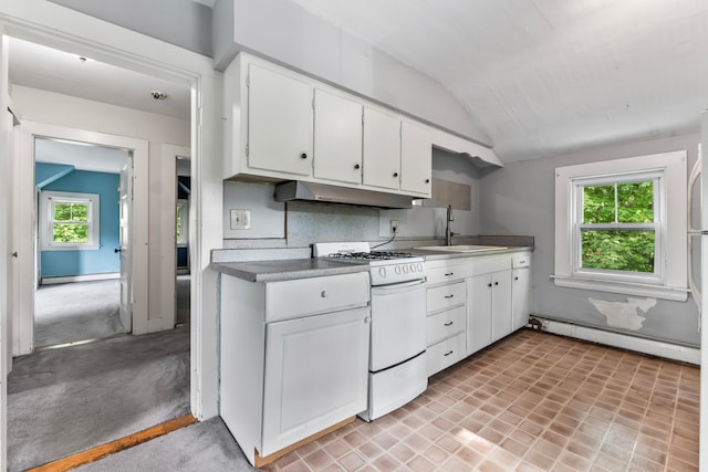 kitchen with white cabinetry, lofted ceiling, white range with gas cooktop, a baseboard radiator, and sink