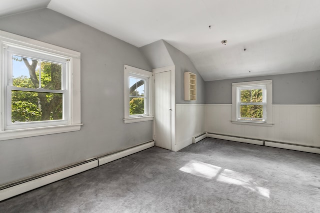 bonus room with carpet, a baseboard heating unit, and vaulted ceiling