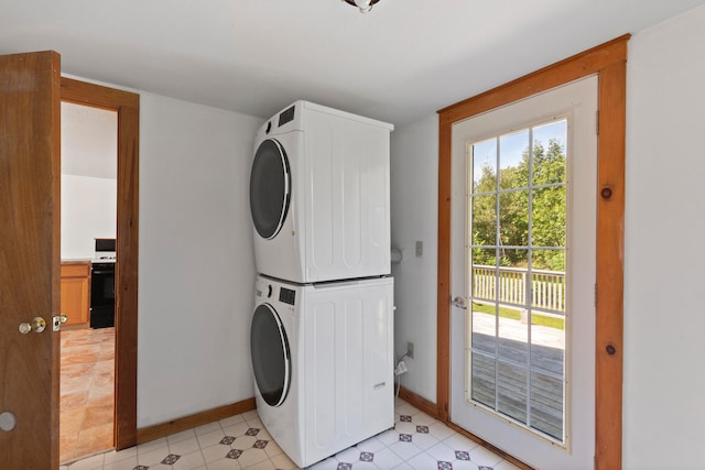 laundry area featuring stacked washer / dryer