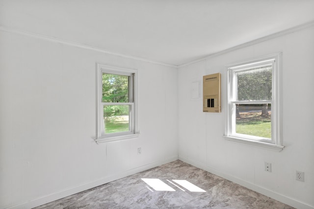 unfurnished room with crown molding