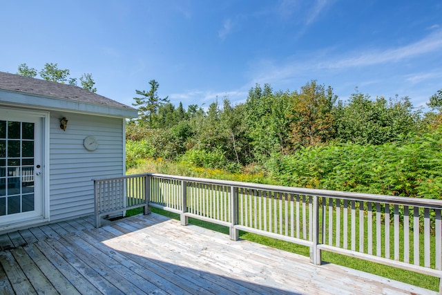 wooden terrace with a yard