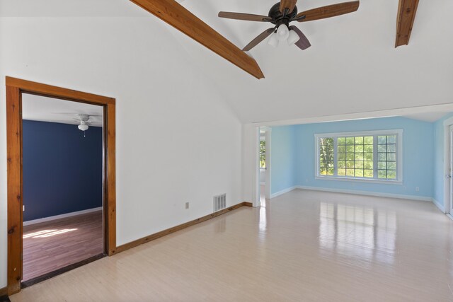 empty room featuring ceiling fan, beam ceiling, and light hardwood / wood-style flooring