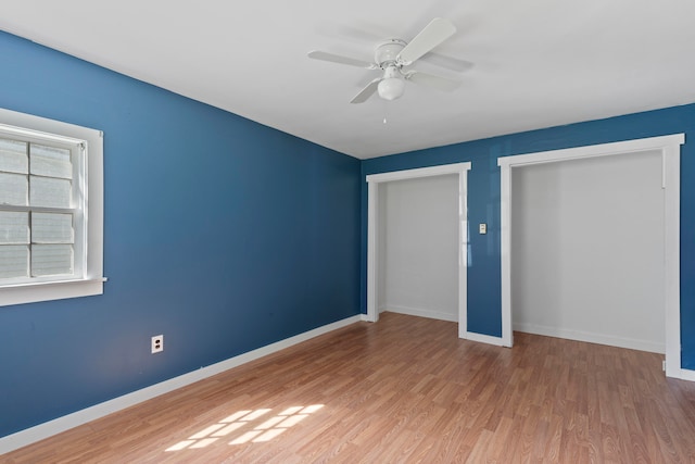 unfurnished bedroom featuring hardwood / wood-style floors and ceiling fan