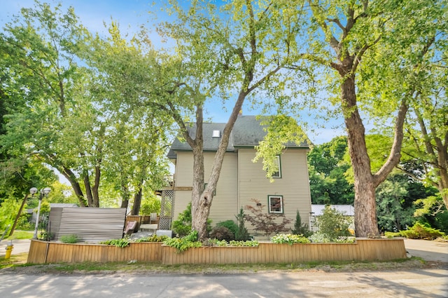 view of side of property with a deck