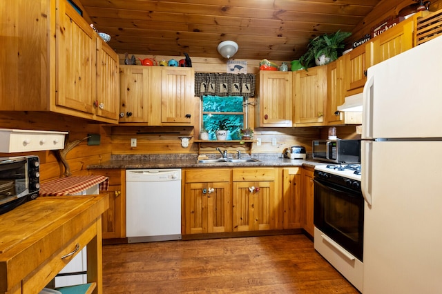 kitchen with dark stone counters, wooden ceiling, hardwood / wood-style flooring, sink, and white appliances