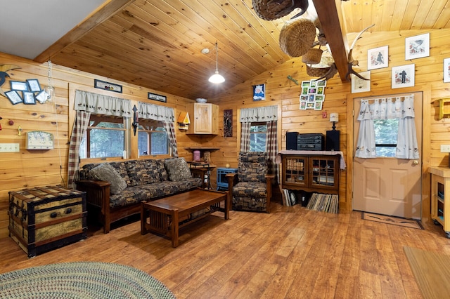 living room with light wood-type flooring, wood ceiling, wooden walls, and lofted ceiling