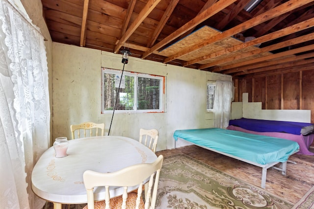 bedroom featuring wooden ceiling and lofted ceiling with beams