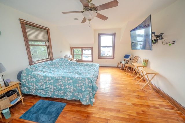 bedroom with ceiling fan and light hardwood / wood-style flooring