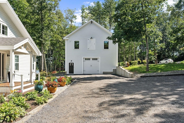 view of side of property with a garage