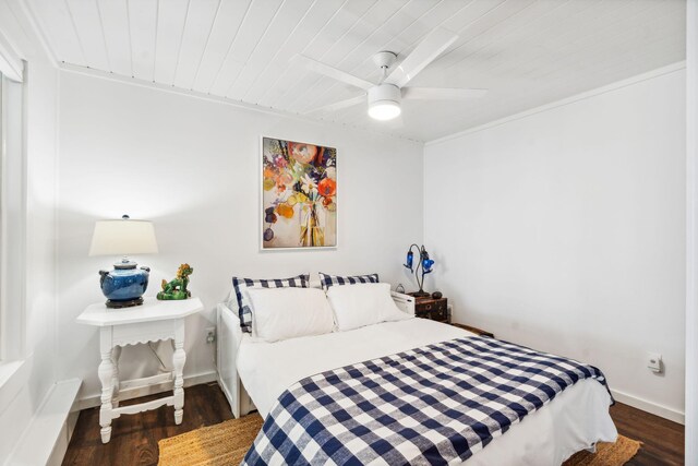 bedroom featuring ceiling fan and dark hardwood / wood-style floors