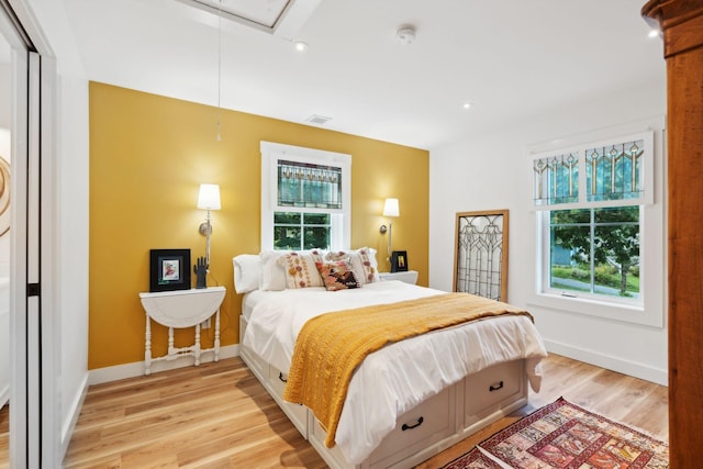 bedroom with light hardwood / wood-style floors