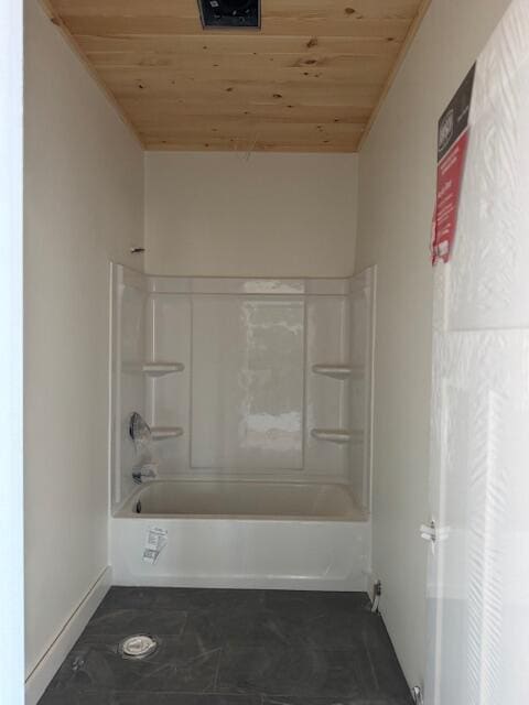 bathroom featuring tub / shower combination and wood ceiling