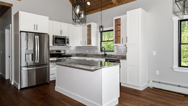 48 Harmony Row, Bethel, ME 04217 - kitchen featuring appliances with stainless steel finishes, dark wood-style floors, light stone countertops, white cabinets, and a kitchen island