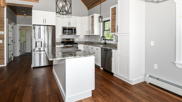 48 Harmony Row, Bethel, ME 04217 - kitchen featuring stainless steel appliances, a baseboard heating unit, stone counters, dark wood finished floors, and high vaulted ceiling